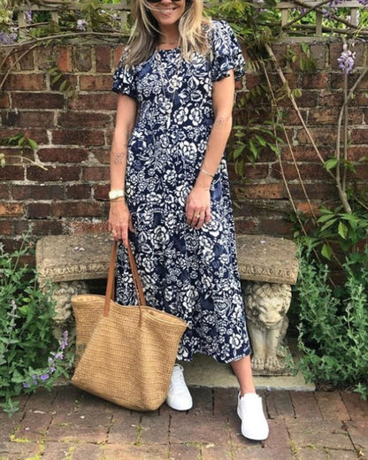 Maas & Mode® | Lange jurk met korte mouwen en bloemenprint